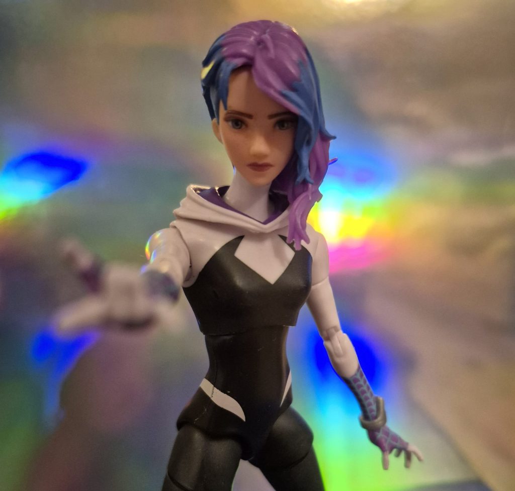 Marvel Legends Across the Spider-Verse Spider-Gwen aiming her web shooter at the camera.